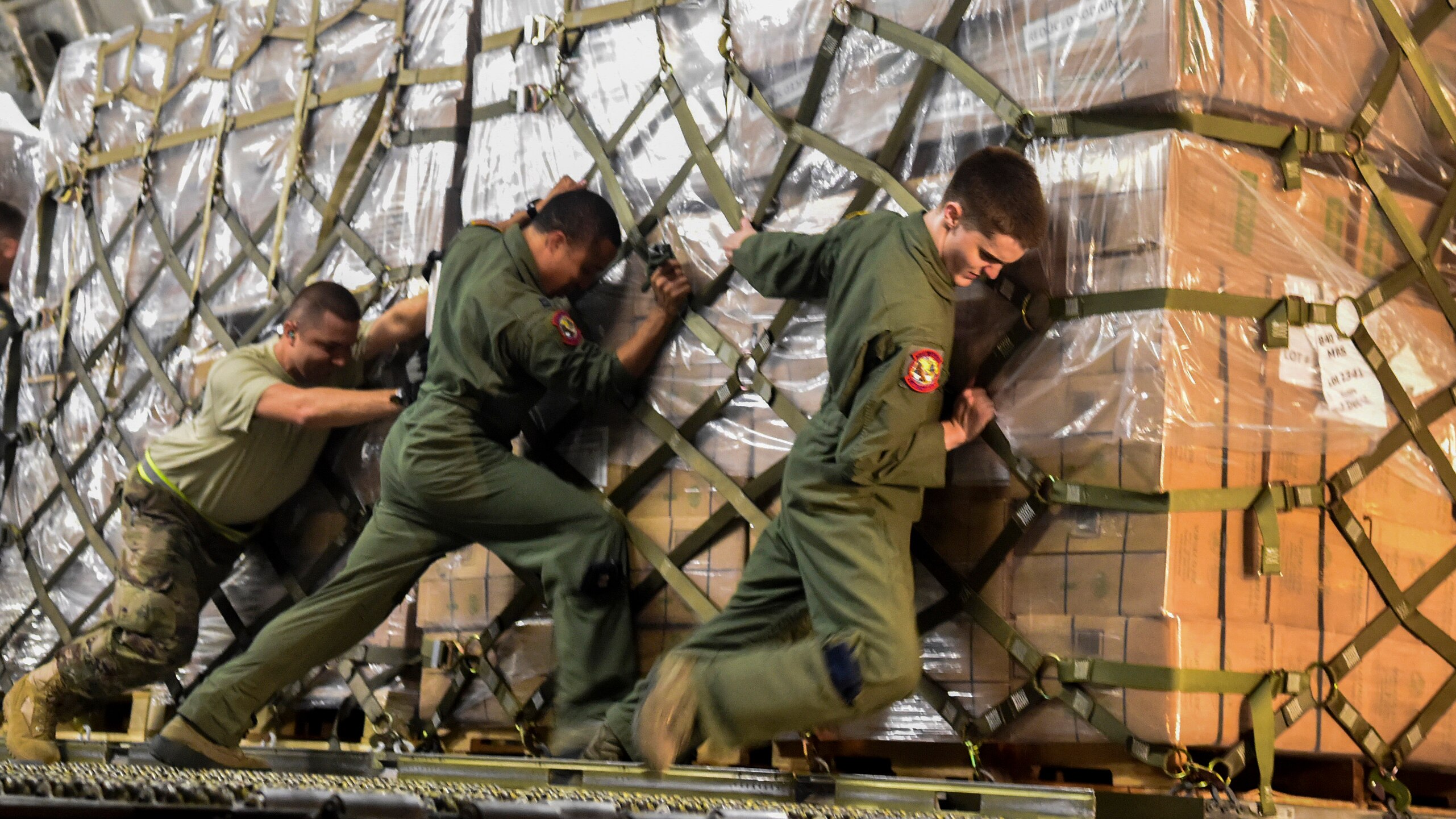 Pallets of food and water are offloaded at San Juan, Puerto Rico
