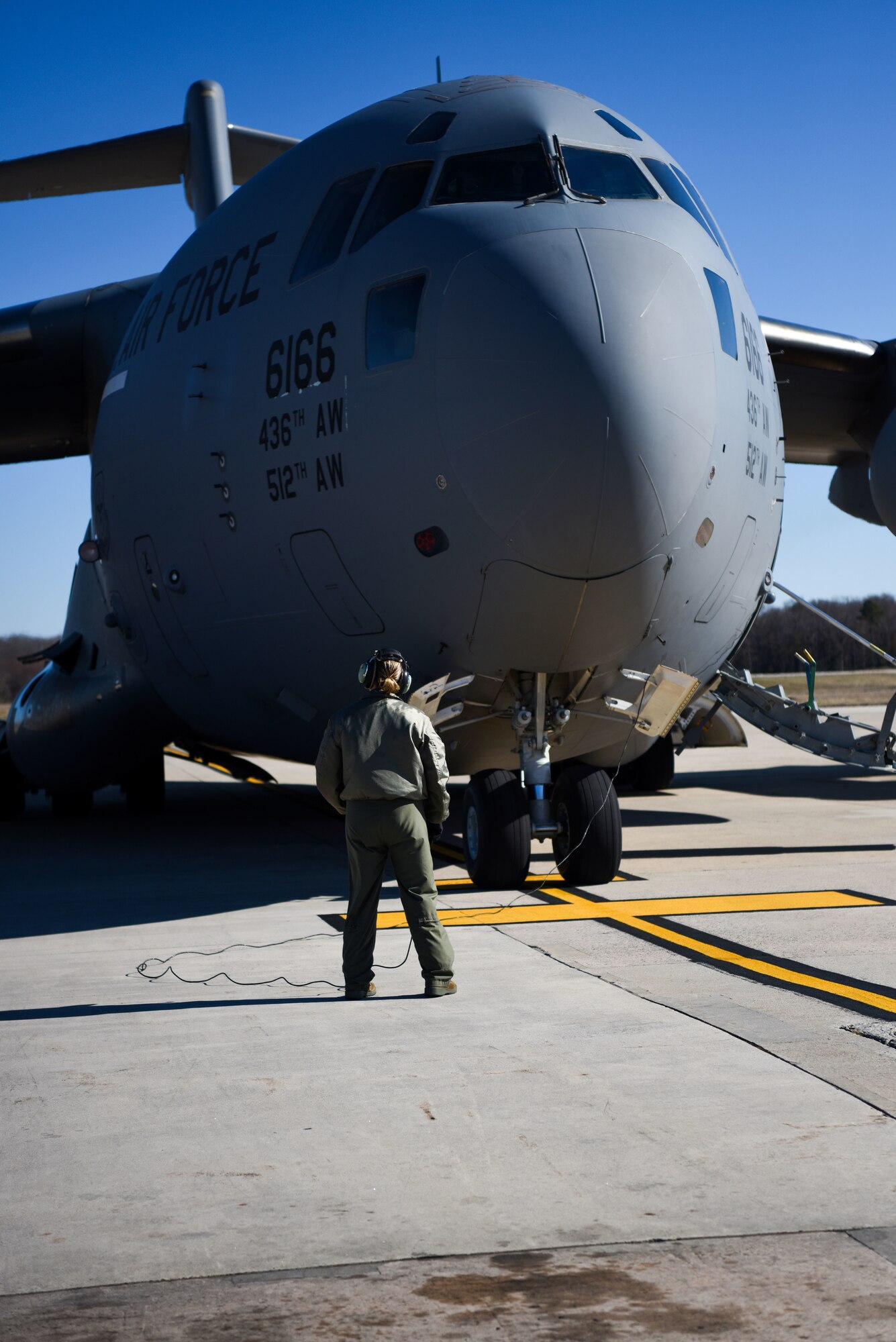 Senior Master Sgt. Lori Tascione, 3rd Airlift Squadron superintendent, scans a C-17 Globemaster III for engine start March 5, 2018, at Dover Air Force Base, Del. Tascione joined an all-female crew to fly the final flight of her career. (U.S. Air Force Photo by Airman 1st Class Zoe M. Wockenfuss)
