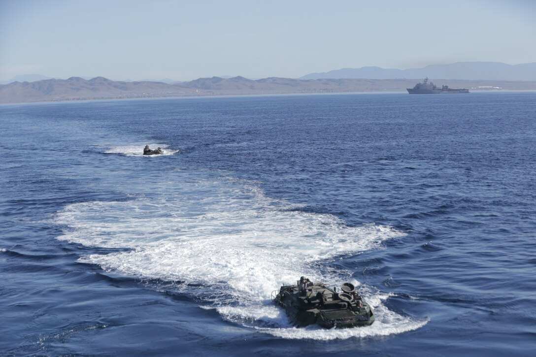 Marines with 3rd Assault Amphibian Battalion, 1st Marine Division, and Japanese Soldiers with the Western Army Infantry Regiment, Japan Ground Self Defense Force, launch from Marine Corps Base Camp Pendleton’s Red Beach training area drive to and board the USS Rushmore (LSD-47) in Amphibious Assault Vehicles during exercise Iron Fist 2018, Jan. 31. When vehicles launch from a beach to board a ship, rather than embark at a pier, it is referred to as an in-stream on-load. Iron Fist is an annual, bilateral amphibious training exercise held in Southern California between the U.S. Marine Corps and the JGSDF. The Japanese Soldiers and U.S. Marines have trained together in Southern California via this annual, bilateral exercise for 13 consecutive years. (U.S. Marine Corps photo by Cpl. Kyle McNan)