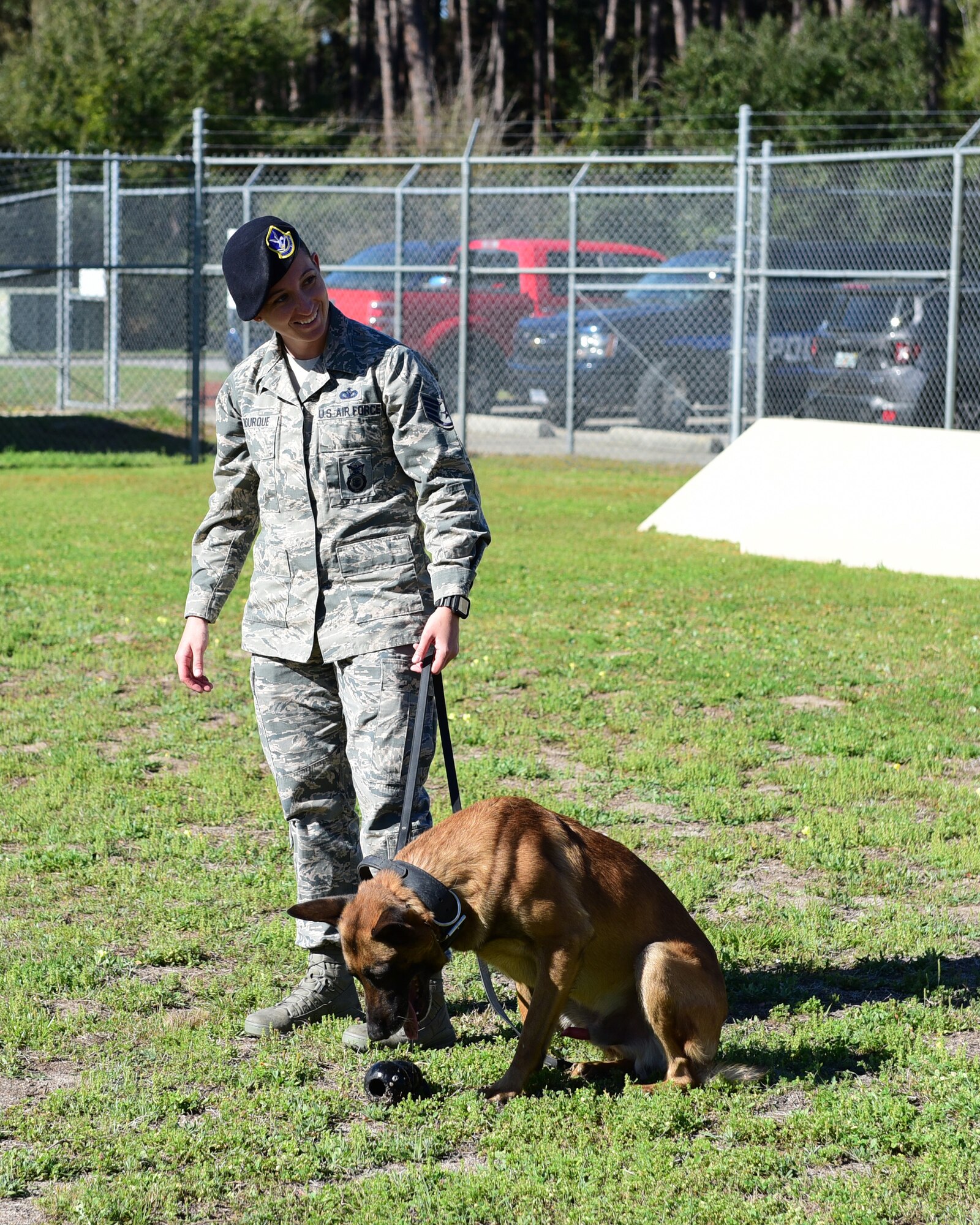 U.S. Air Force Staff Sgt. Caitlin Bourque, 325th Security Forces Squadron military working dog handler, and her partner, Atila, during an interview at Tyndall Air Force Base, Fla. March 2, 2018. A military working dog handler is responsible for the care and training of his or her service dog, which contributes to combat operations abroad and installation security at home by providing target odor detection for both explosives and drugs. (U.S. Air Force photo by Senior Airman Cody R. Miller/Released)