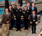 IMAGE: DAHLGREN, Va. (Feb. 16, 2018) - Japanese Vice Adm. Hideki Yuasa and Capt. Takuro Koroki are pictured with their delegation and Naval Surface Warfare Center Dahlgren Division (NSWCDD) leadership in front of the electromagnetic railgun prototype launcher. Yuasa is president of the Japan Maritime Self-Defense Force (JMSDF) Maritime Command and Staff College in Tokyo and Koroki is the naval attaché for the Embassy of Japan and the JMSDF delegation. Yuasa led the Japanese delegation to see new and emerging technologies developed at NSWCDD. Navy scientists and engineers briefed the Japanese delegation on human systems integration, electromagnetic launchers, hypervelocity projectiles, and directed energy weapons, in addition to the command's capabilities in complex warfare systems development and integration to incorporate electric weapons technology into existing and future fighting forces and platforms. (U.S. Navy photo/Released)