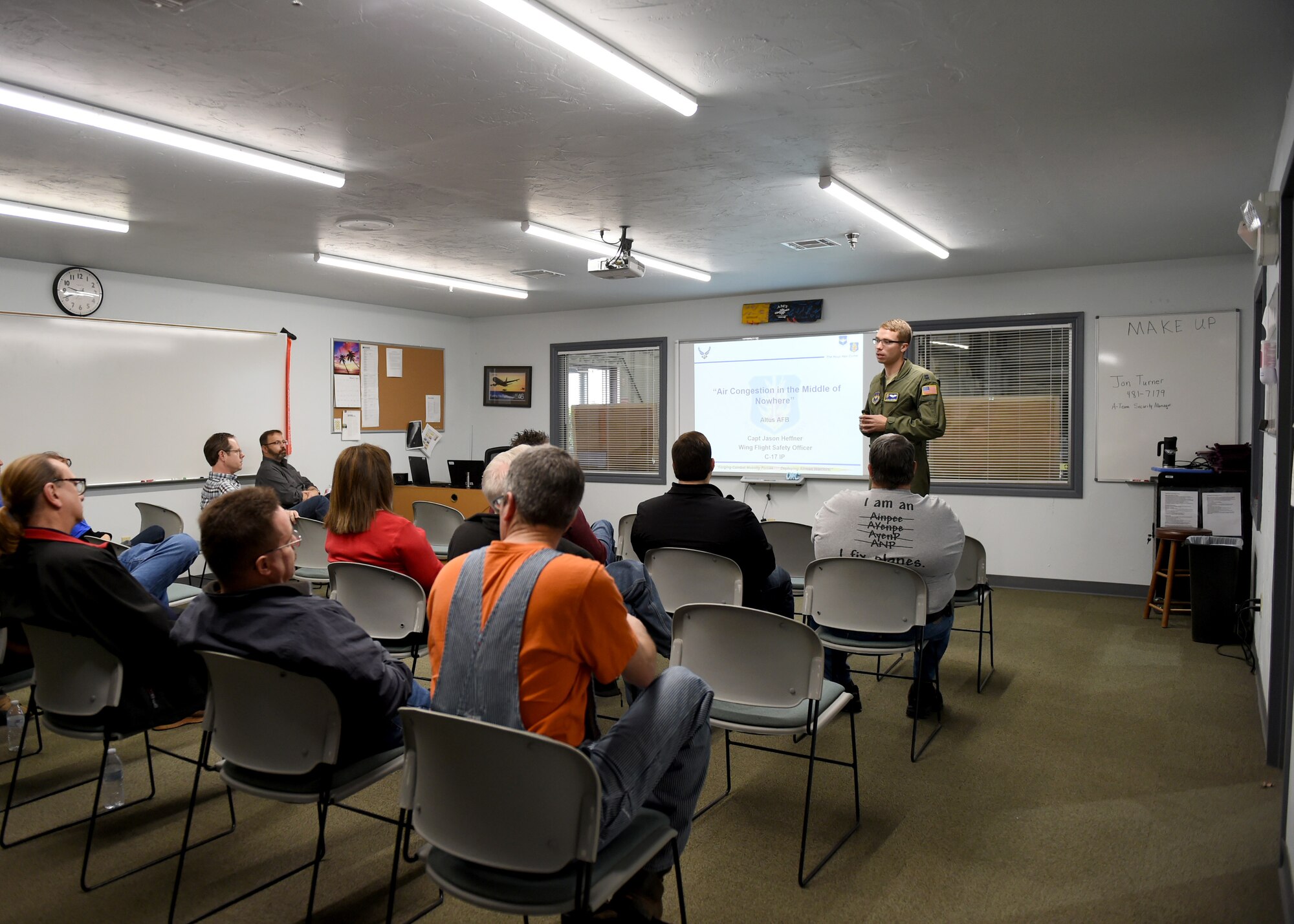 U.S. Air Force Capt Jason Heffner, a flight safety officer assigned to the 97th Air Mobility Wing, gives a safety briefing to civilian pilots and pilots in training, March 10, 2018, at Altus Air Force Base, Okla.