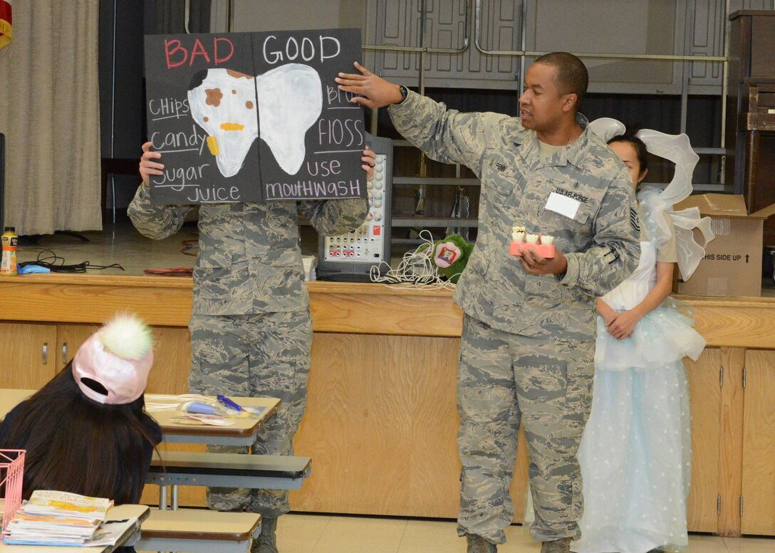 Tech. Sgt. Robert Penn, 412th Aerospace Medicine Squadron, discusses bad and good oral hygiene habits in front of Branch Elementary first graders March 1. Members of the 412th Medical Group dropped by the school as part of their recognition of National Children’s Dental Health Month. (U.S. Air Force photo by Kenji Thuloweit)