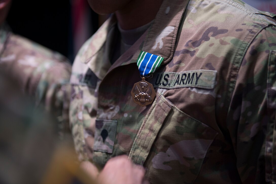 A U.S. Army Soldier wears an Army achievement medal in Wylie Theater at Joint Base Langley-Eustis, Virginia, March 1, 2018. The award ceremony concluded the week-long 597th Trans. Bde. Rapid Support Challenge. (U.S. Air Force photo by Monica Roybal)