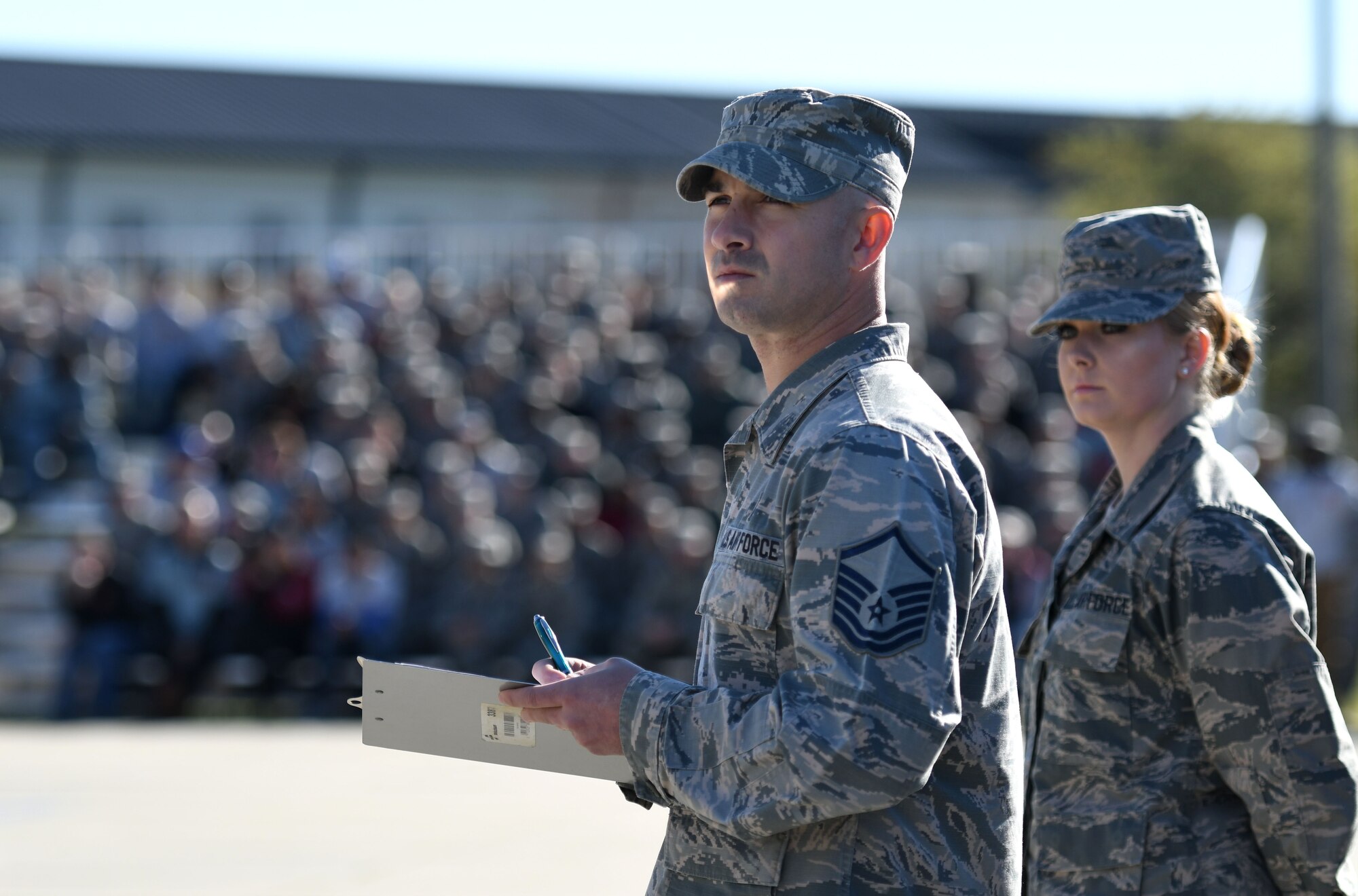 U.S. Air Force Master Sgt. Kyle Grantham, Mathies NCO Academy faculty development superintendent, serves as a judge during the 81st Training Group drill down on the Levitow Training Support Facility drill pad March 9, 2018, on Keesler Air Force Base, Mississippi. Airmen from the 81st TRG competed in a quarterly open ranks inspection, regulation drill routine and freestyle drill routine. The 335th Training Squadron “Bulls” took first place this quarter. (U.S. Air Force photo by Kemberly Groue)