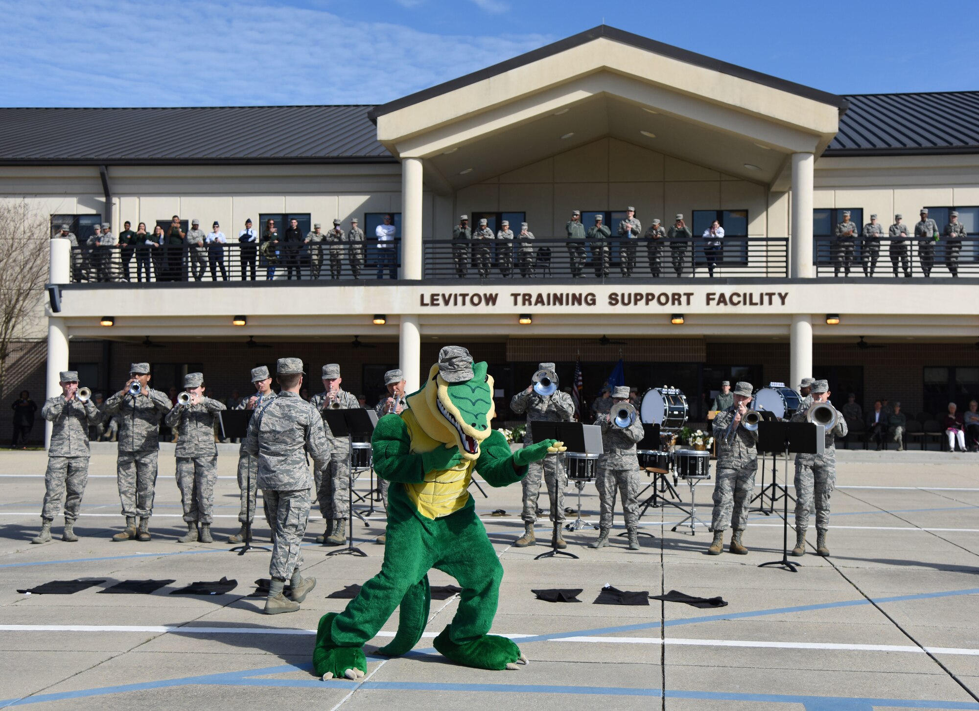 The 334th Training Squadron “Gator” mascot dances a Drum and Bugle Corps performance during the 81st Training Group drill down on the Levitow Training Support Facility drill pad March 9, 2018, on Keesler Air Force Base, Mississippi. Airmen from the 81st TRG competed in a quarterly open ranks inspection, regulation drill routine and freestyle drill routine. The 335th TRS “Bulls” took first place this quarter. (U.S. Air Force photo by Kemberly Groue)
