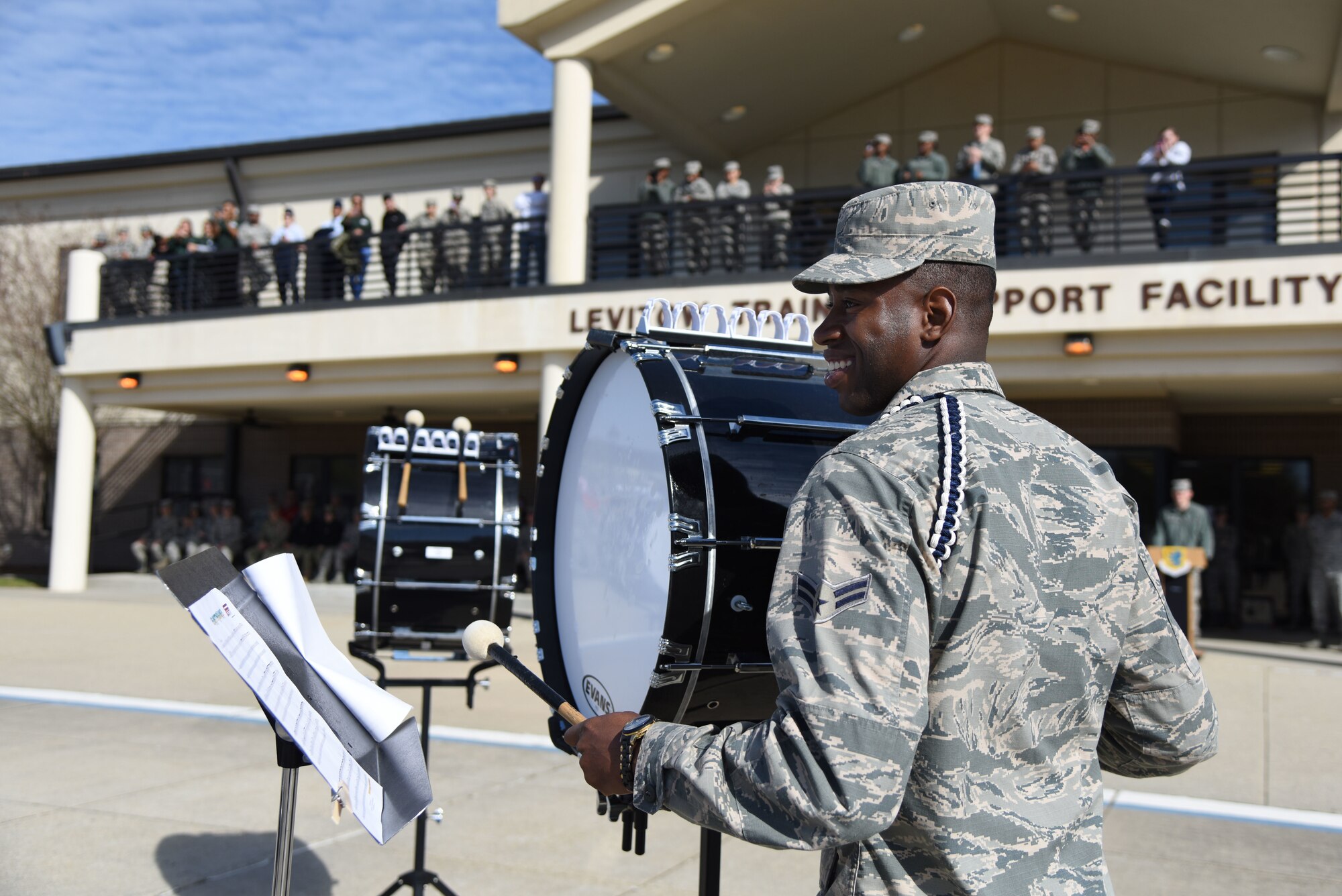 U.S. Air Force Airman 1st Class Jeffrey Davis, 81st Training Group Drum and Bugle Corps member, performs during the 81st TRG drill down on the Levitow Training Support Facility drill pad March 9, 2018, on Keesler Air Force Base, Mississippi. Airmen from the 81st TRG competed in a quarterly open ranks inspection, regulation drill routine and freestyle drill routine. The 335th Training Squadron “Bulls” took first place this quarter. (U.S. Air Force photo by Kemberly Groue)