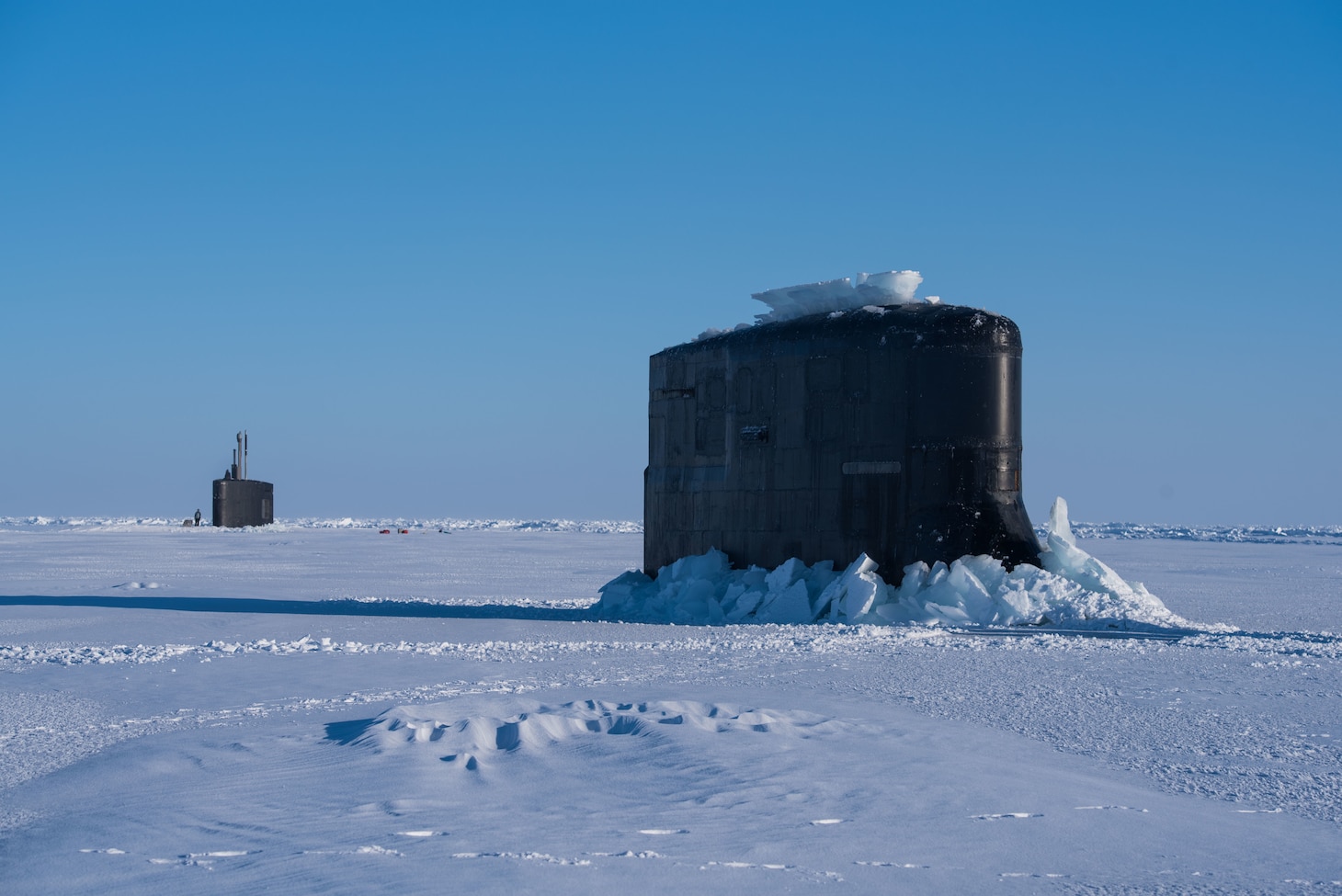 Ice Camp Skate (March 10, 2018) – Seawolf-class submarine USS Connecticut SSN 22 and Los Angeles-class fast-attack submarine USS Hartford SSN 768 breakthrough the ice March 9, 2018 in support of Ice Exercise (ICEX) 2018. ICEX 2018 is a five-week exercise that allows the Navy to assess its operational readiness in the Arctic, increase experience in the region, advance understanding of the Arctic environment, and continue to develop relationships with other services, allies and partner organizations. (U.S. Navy photo by Mass Communication 2nd Class Micheal H. Lee)