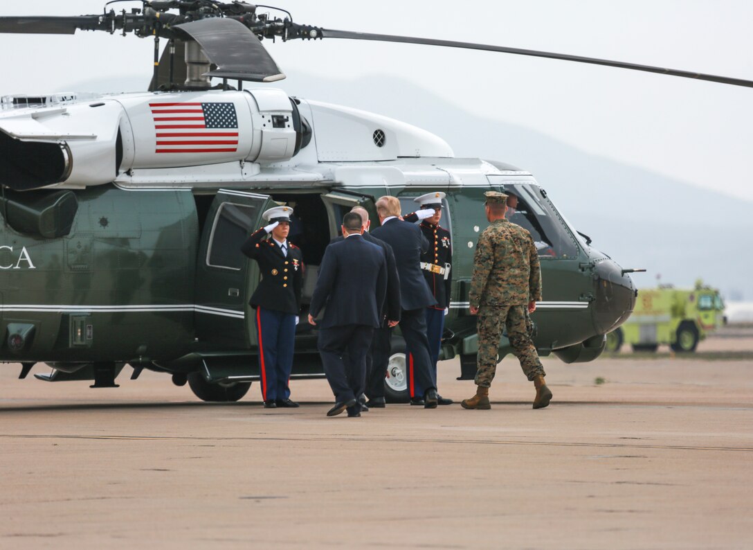 President of the United States Donald J. Trump boards a nearby aircraft to depart Marine Corps Air Station Miramar, Calif., March 13, 2018. President Trump visited MCAS Miramar to speak to service members and their families. (U.S. Marine Corps photo by Cpl. Becky Calhoun/Released)