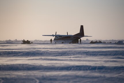 Members of Ice Camp Skate load cargo into a plane March 9, 2018 in support of Ice Exercise (ICEX) 2018. ICEX 2018 is a five-week exercise that allows the Navy to assess its operational readiness in the Arctic, increase experience in the region, advance understanding of the Arctic environment, and continue to develop relationships with other services, allies and partner organizations. (U.S. Navy photo by Mass Communication 2nd Class Micheal H. Lee)