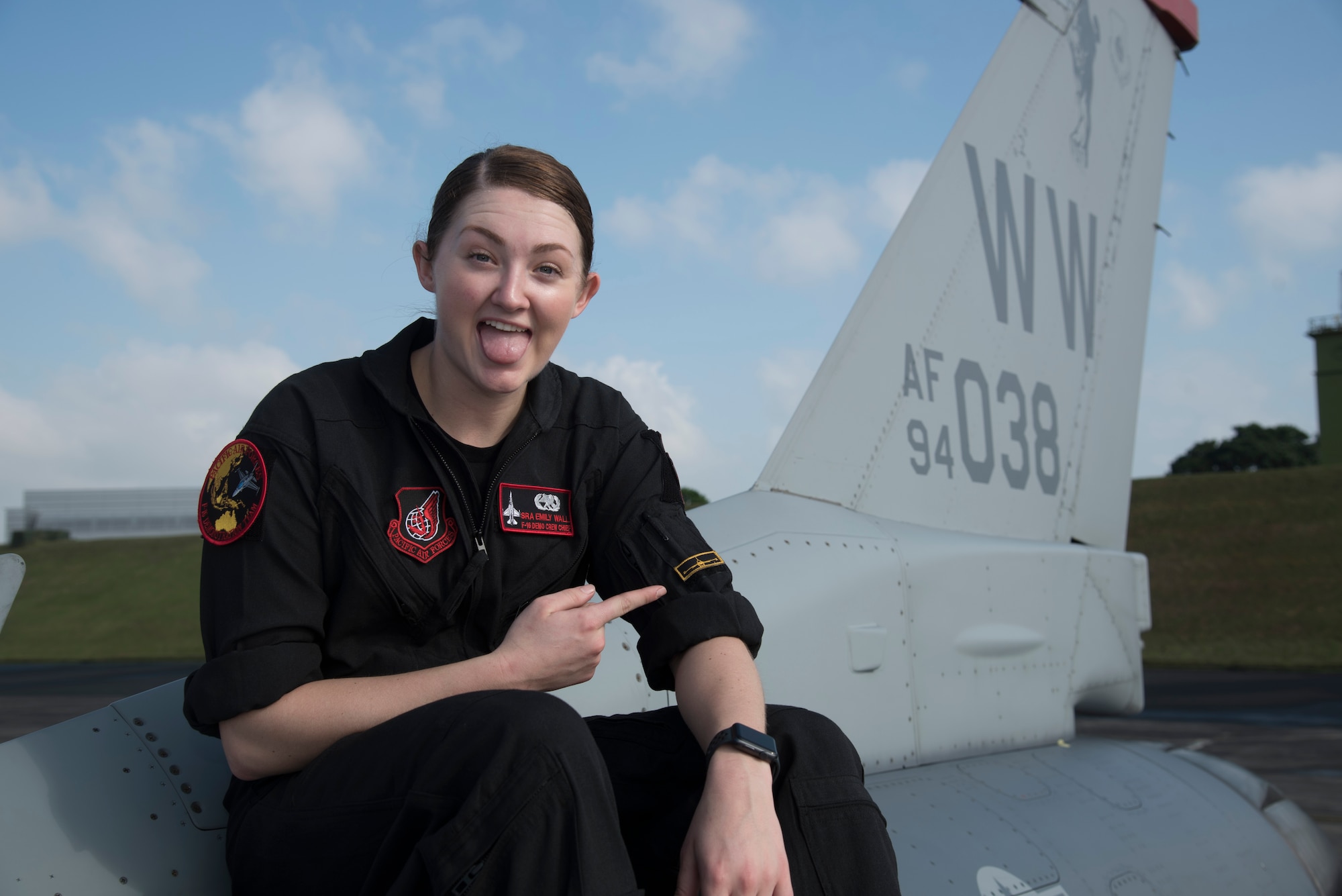 U.S. Air Force Senior Airman Emily Wall, a Pacific Air Forces' Demonstration Team crew chief, pauses for a photo after performing maintenance on an F-16 Fighting Falcon at Paya Lebar Air Base, Singapore, Feb. 3, 2018. As a surprise to her family, Wall took a different route than her siblings and enlisted in the military knowing she wanted to impact her peers, travel the world and make a difference for her country. After her four years of experience, she now encourages other women in her profession to push through and overcome adversity in the maintenance world. (U.S. Air Force photo by Senior Airman Sadie Colbert)