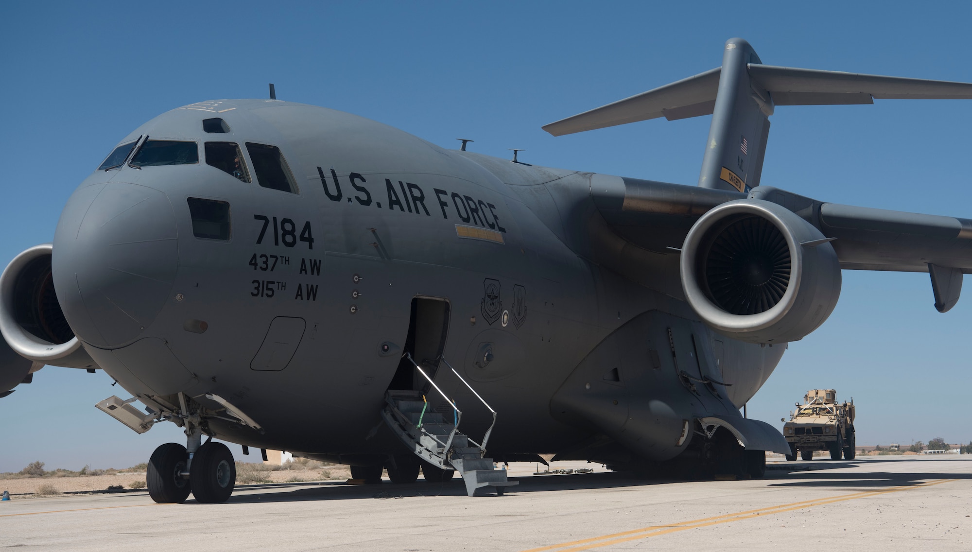 Mine-resistant ambush protected vehicles are loaded onto a C-17 Globemaster III at an undisclosed location in Southwest Asia March 7, 2018.