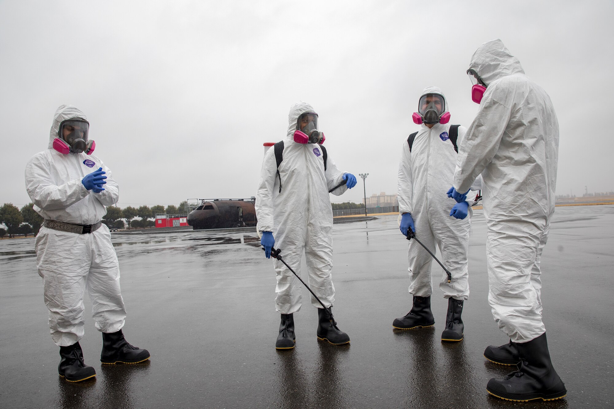 Airmen with the 374th Maintenance Squadron repair and reclamation section confirm a simulated aircraft fire recovery operation at Yokota Air Base