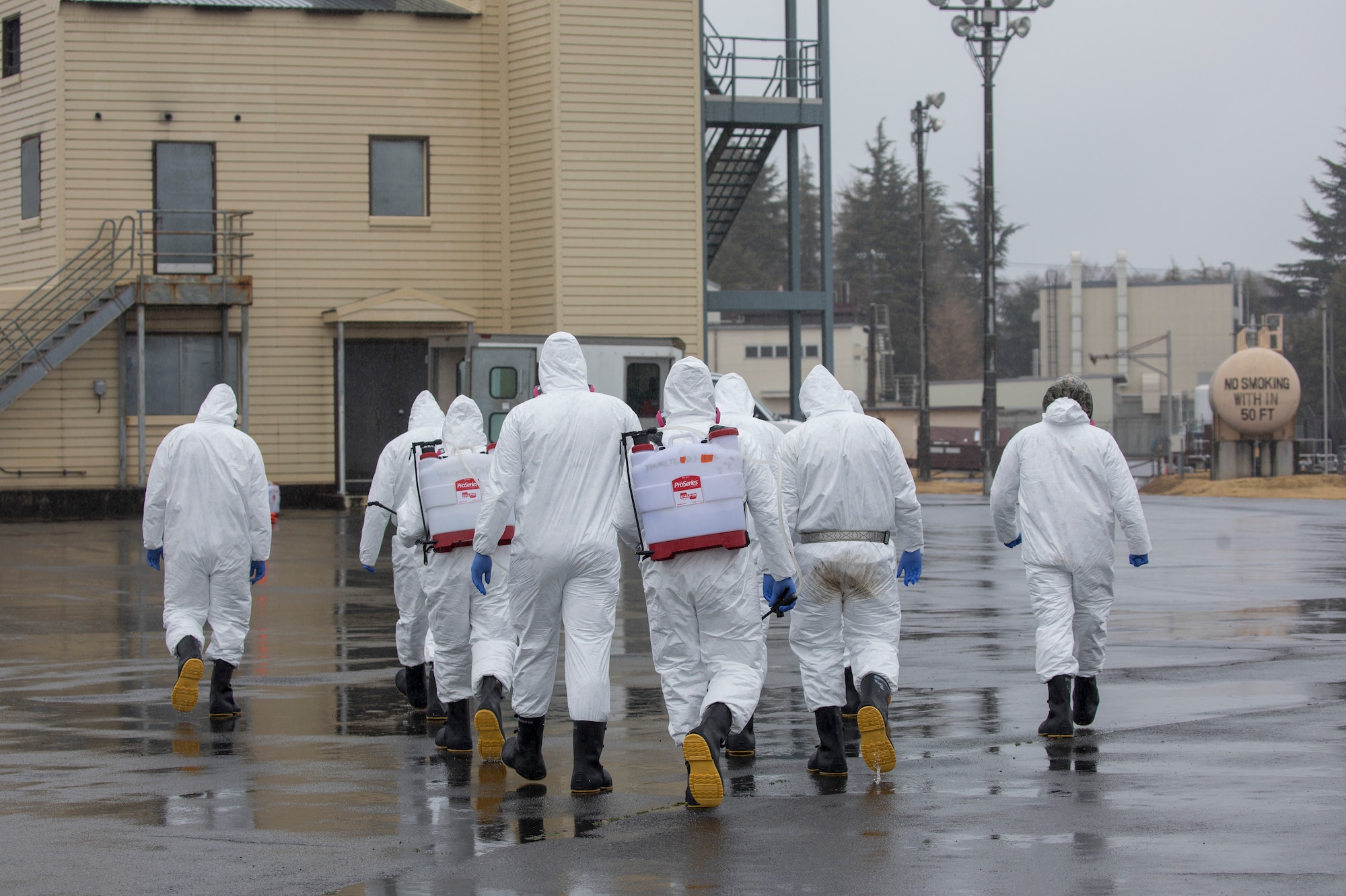 Airmen with the 374th Maintenance Squadron repair and reclamation section complete a simulated decontamination procedures at Yokota Air Base, Japan