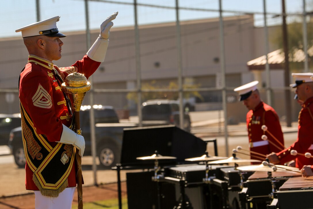 Master Sgt. Keith Martinez, drum major, “The Commandant’s Own,” U.S. Marine Drum & Bugle Corps, conducts the D&B during a dress rehearsal of the Battle Color ceremony at Marine Corps Air Station Yuma, Yuma, Az., March 2, 2018. This dress rehearsal marks the end of the Marines’ month-long training phase in Yuma. The Marines will move on to display their hard work and dedication during their performances on the West Coast Tour and throughout the 2018 parade season.  (Official Marine Corps photo by Cpl. Damon Mclean/Released)