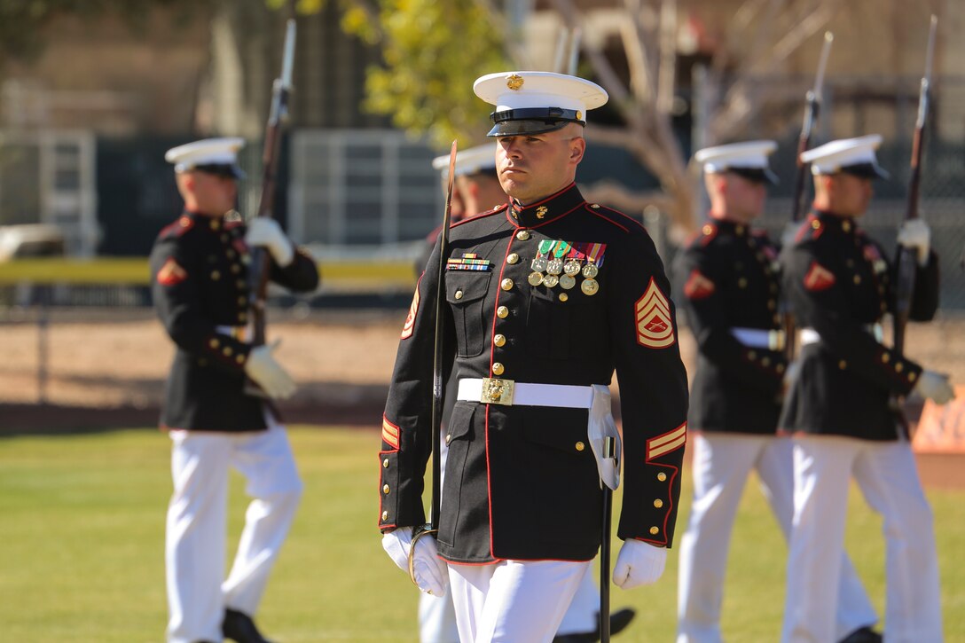 Gunnery Sgt. Michael Charneske, platoon sergeant, U.S. Marine Corps Silent Drill Platoon, marches across the field during a dress rehearsal of the Battle Color ceremony at Marine Corps Air Station Yuma, Yuma, Az., March 2, 2018. This dress rehearsal marks the end of the Marines’ month-long training phase in Yuma. The Marines will move on to display their hard work and dedication during their performances on the West Coast Tour and throughout the 2018 parade season. (Official Marine Corps photo by Cpl. Damon Mclean/Released)