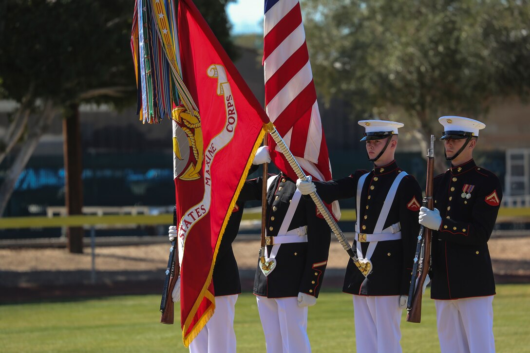 The U.S. Marine Corps Color Guard lowers the U.S. Marine Corps Battle Colors during the playing of the National Anthem during a dress rehearsal of the Battle Color ceremony at Marine Corps Air Station Yuma, Yuma, Az., March 2, 2018. This dress rehearsal marks the end of the Marines’ month-long training phase in Yuma. The Marines will move on to display their hard work and dedication during their performances on the West Coast Tour and throughout the 2018 parade season. (Official Marine Corps photo by Cpl. Damon Mclean/Released)