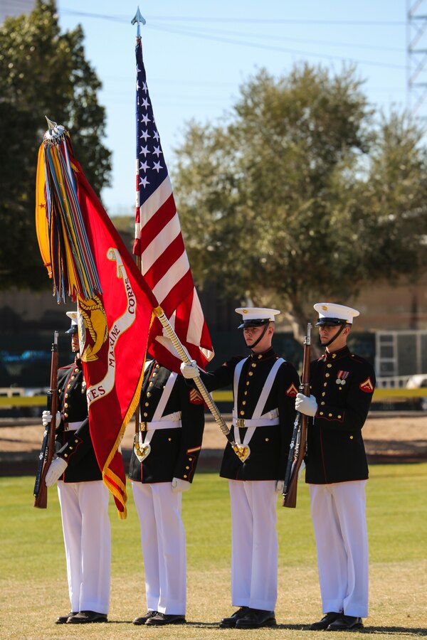 Marines with the U.S. Marine Corps Color Guard render honors as the National Flag is presented during a dress rehearsal of the Battle Color ceremony at Marine Corps Air Station Yuma, Yuma, Az., March 2, 2018. This dress rehearsal marks the end of the Marines’ month-long training phase in Yuma. The Marines will move on to display their hard work and dedication during their performances on the West Coast Tour and throughout the 2018 parade season. (Official Marine Corps photo by Cpl. Damon Mclean/Released)