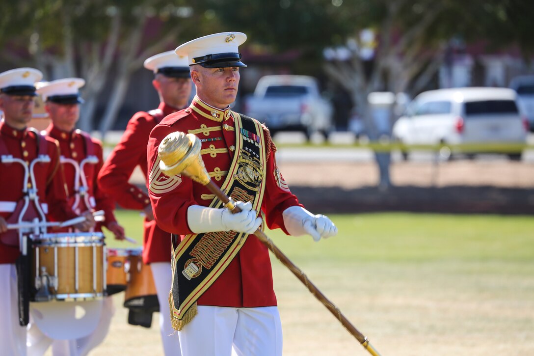 Master Sgt. Keith Martinez, drum major, “The Commandant’s Own,” U.S. Marine Drum & Bugle Corps, conducts the D&B during a dress rehearsal of the Battle Color ceremony at Marine Corps Air Station Yuma, Yuma, Az., March 2, 2018. This dress rehearsal marks the end of the Marines’ month-long training phase in Yuma. The Marines will move on to display their hard work and dedication during their performances on the West Coast Tour and throughout the 2018 parade season.(Official Marine Corps photo by Cpl. Damon Mclean/Released)