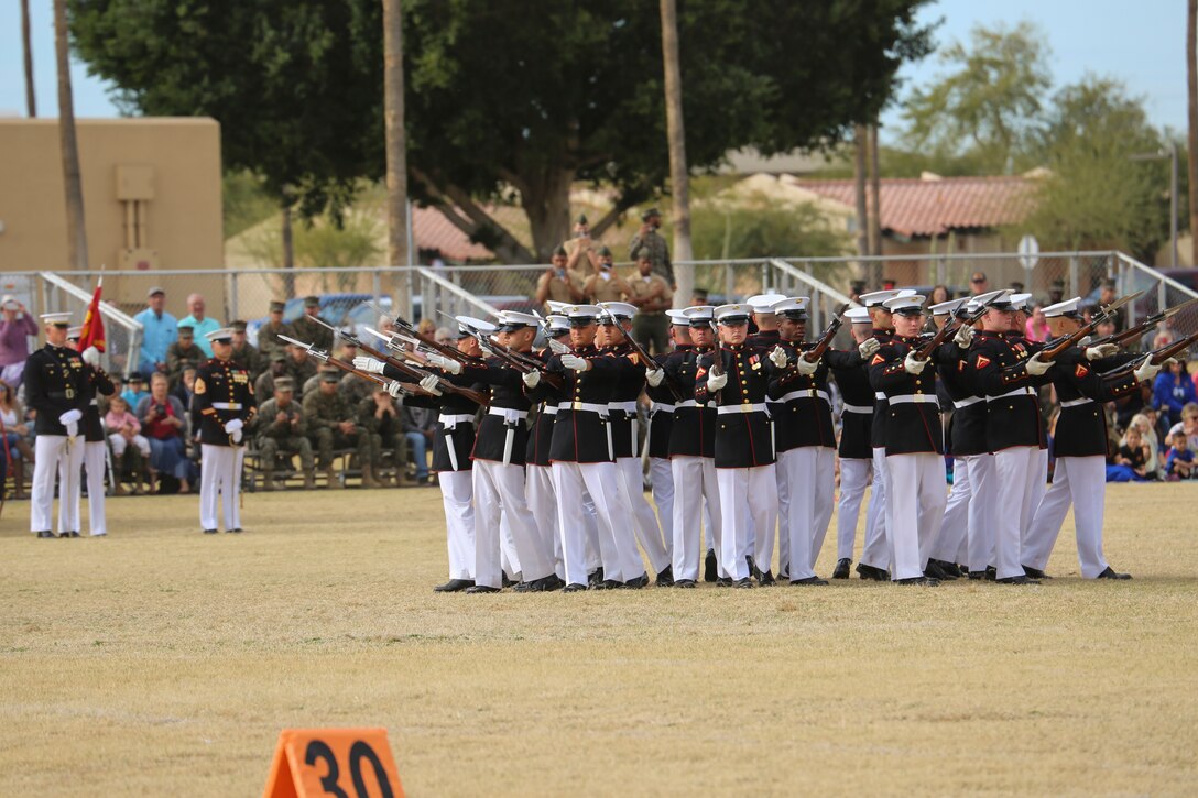 The U.S. Marine Corps Silent Drill Platoon executes their “bursting bomb” sequence during the first West Coast tour performance at Marine Corps Air Station Yuma, Yuma, Az., March 7, 2018. Col. David A. Suggs, commanding officer, MCAS Yuma, was the hosting official and spoke to the Marines of the BCD after the performance. (Official Marine Corps photo by Cpl. Damon Mclean/Released)
