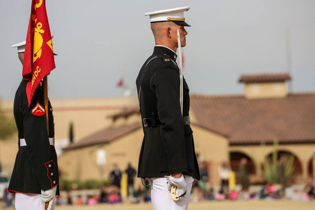 Captain Matthew S. Galadyk, platoon commander, U.S. Marine Corps Silent Drill Platoon, prepares for “pass in review” during the first West Coast tour performance at Marine Corps Air Station Yuma, Yuma, Az., March 7, 2018. Col. David A. Suggs, commanding officer, MCAS Yuma, acted as the hosting official and spoke to the Marines of the BCD after the performance. (Official Marine Corps photo by Cpl. Damon Mclean/Released)