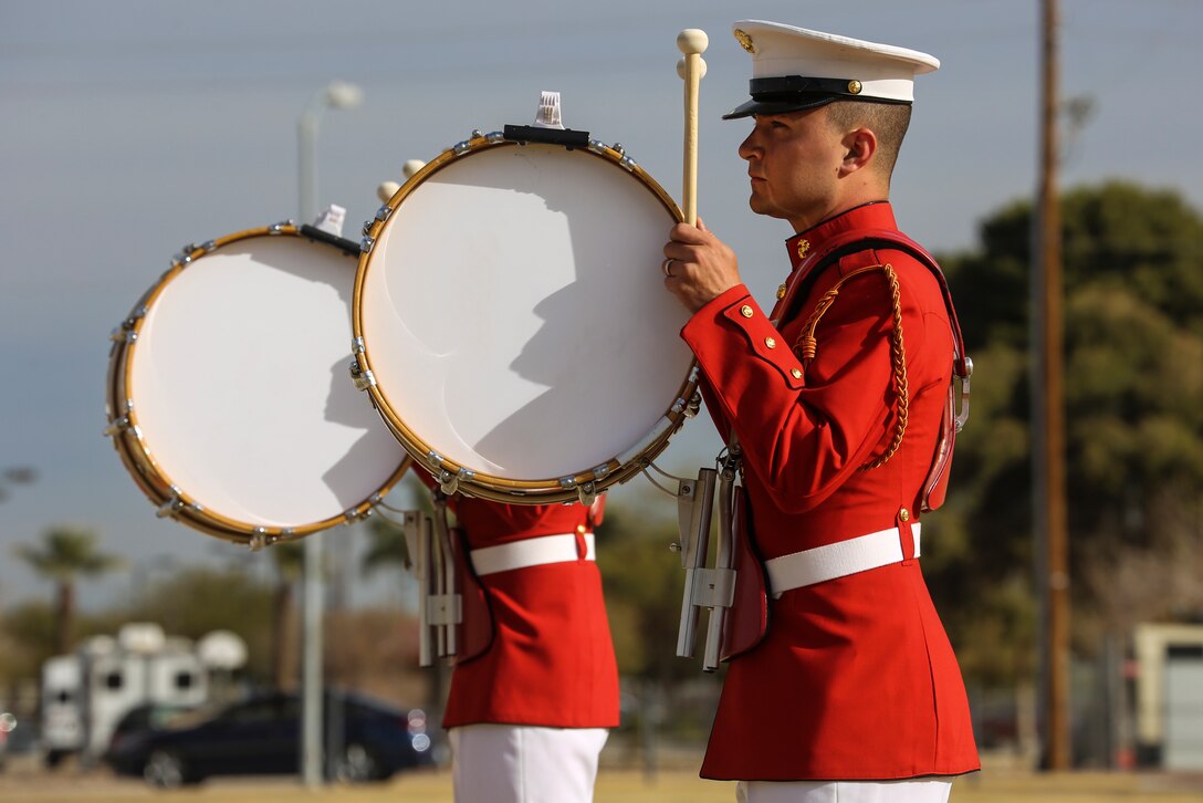Marines with “The Commandant’s Own,” U.S. Marine Drum & Bugle Corps, play their instruments during the first West Coast tour performance at Marine Corps Air Station Yuma, Yuma, Az., March 7, 2018. Col. David A. Suggs, commanding officer, MCAS Yuma, was the hosting official and spoke to the Marines of the BCD after the performance.(Official Marine Corps photo by Cpl. Damon Mclean/Released)