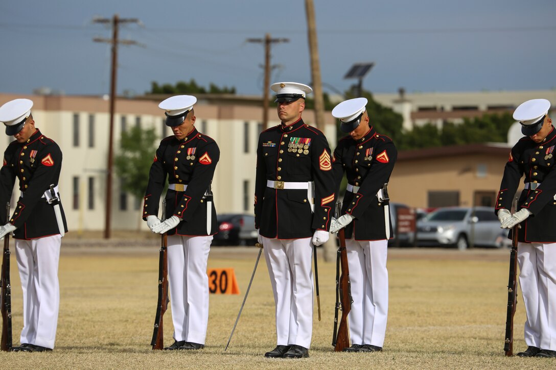 Marines with the U.S. Marine Corps Silent Drill Platoon execute “fixed-bayonets” during the first West Coast tour performance at Marine Corps Air Station Yuma, Yuma, Az., March 7, 2018. Col. David A. Suggs, commanding officer, MCAS Yuma, was the hosting official and spoke to the Marines of the BCD after the performance. (Official Marine Corps photo by Cpl. Damon Mclean/Released)