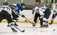 Dover Eagles center Sam Ernst (21) and Dover Fraternal Order of Police Lodge 15 forward Steven Schultz (12), face off during a charity hockey game March 10, 2018, at the Centre Ice Rink in Harrington, Del. The Eagles won the game 8-4, making it two years in a row they have won. (U.S. Air Force photo by Roland Balik)