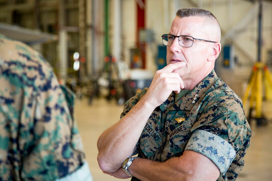 U.S. Marine Corps Lt. Gen. Robert F. Hedelund, commanding general of II Marine Expeditionary Force, receives a brief while touring Marine Corps Air Station (MCAS) Cherry Point, N.C. on July 31, 2017. Hedelund visited MCAS Cherry Point as part of his initial tour of Marine Corps units under his command. (U.S. Marine Corps photo by Sgt. Kowshon Ye)