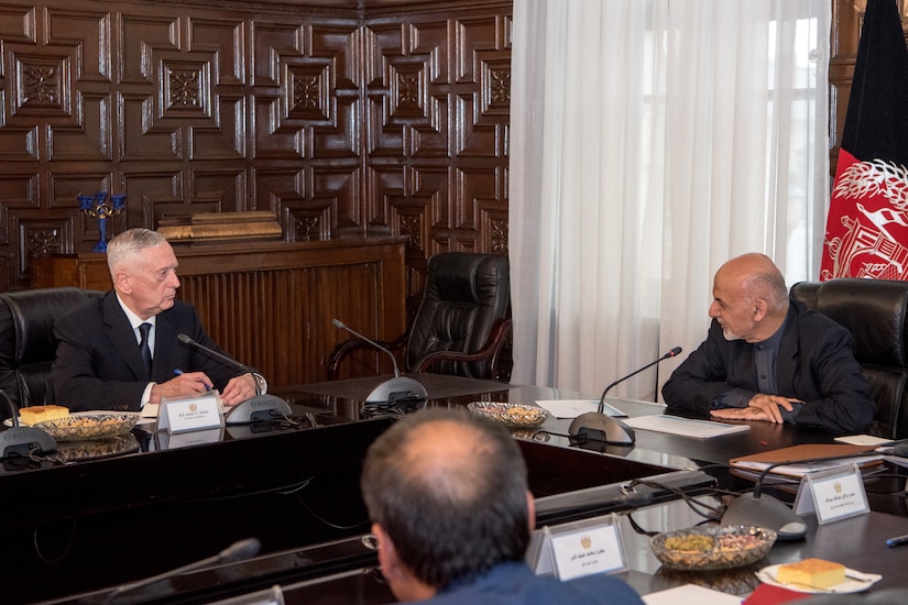 Defense Secretary James N. Mattis sits at a table with the Afghan president.