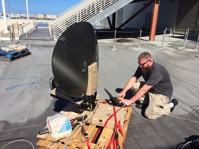 Mark Bossen, one of two information technology specialists on DLA’s rapid deployment Red Team, runs diagnostics on communications equipment during the early stages of humanitarian-relief efforts following Hurricane Maria in Puerto Rico. The team was deployed there for five weeks in October and November