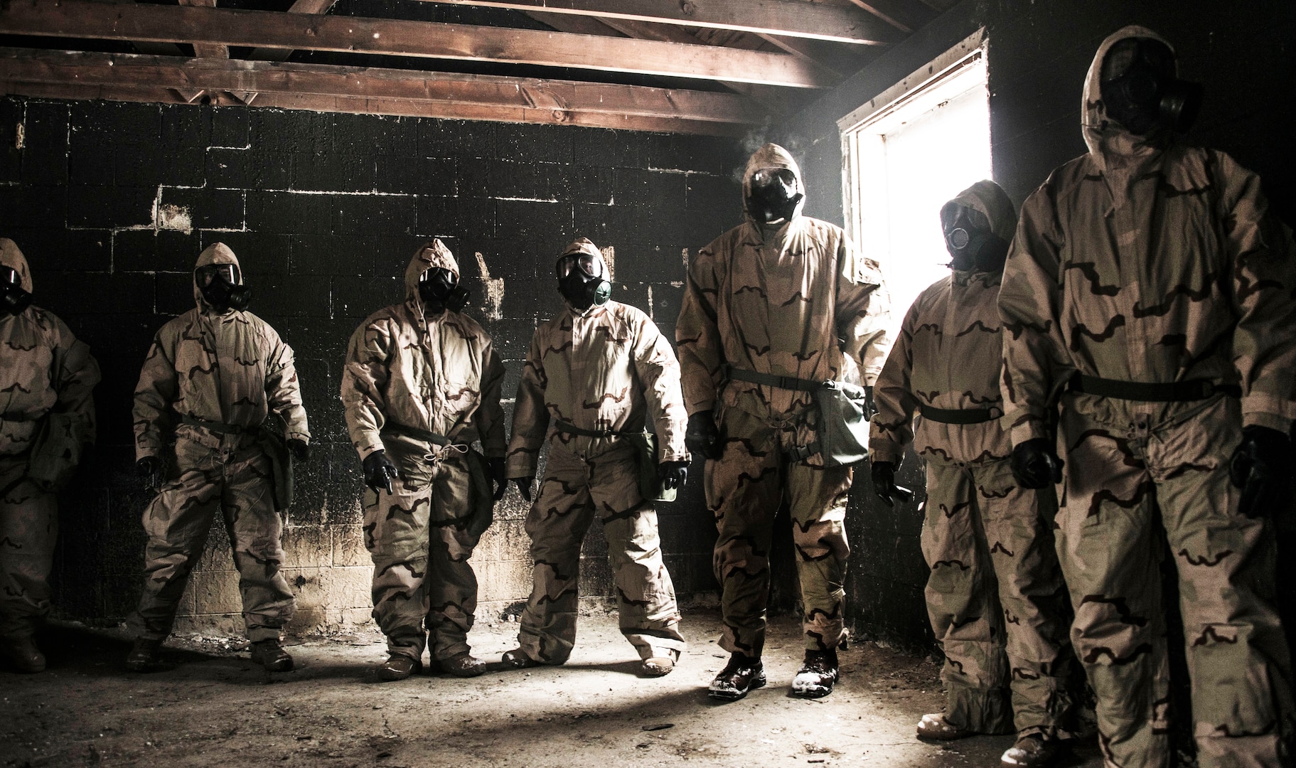 Members of DLA’s rapid deployment Red Team brave the gas chamber to conduct a functions test on personal protective equipment during nuclear, biological and chemical training at Camp Atterbury, Indiana.