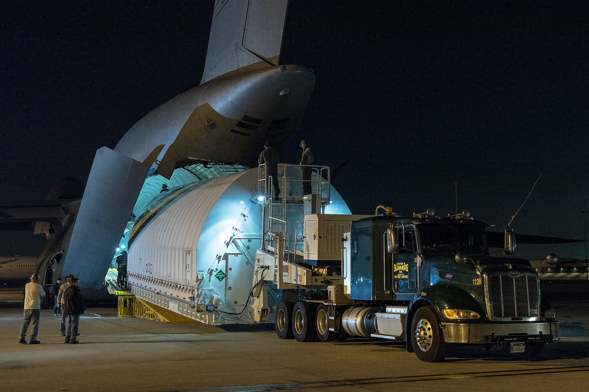 The Space Telescope Transporter for Air, Road and Sea (STTARS), a specially designed shipping container that held the optical telescope and integrated science instrument module (OTIS) of NASA’s James Webb Space Telescope, is unloaded from a specially-modified C-5 Charlie aircraft at Los Angeles International Airport Feb. 2, 2018. The STTARS was certified for flight aboard the aircraft by the Air Force Life Cycle Management Center’s Air Transportability Test Loading Activity May 15, 2014. (NASA photo/Chris Gunn)