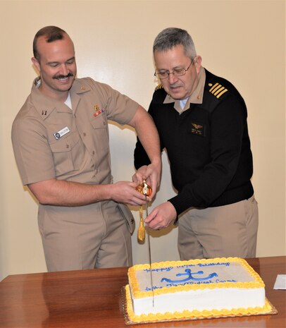 U.S. Navy Lt. Raymond Walston, a physician serving at Naval Health Clinic Charleston, and U.S. Navy Capt. Keith Hanley, NHCC’s chief medical officer, cut the cake during a ceremony celebrating the 147th birthday of the Navy Medical Corps.