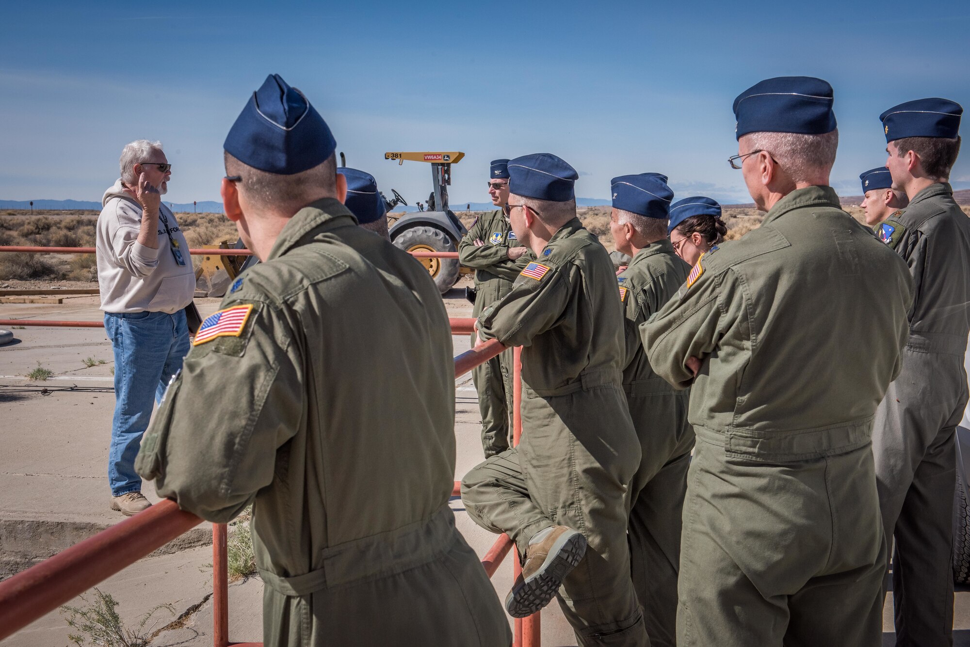 One of the nine flight surgeons who visited Edwards walks to a "lookout spot" to see Rogers Dry Lake and the base. The officers received briefings and tours at the 412th MDG facilities, NASA’s Armstrong Flight Research Center, Joint Strike Fighter units, the Benefield Anechoic Facility, U.S. Air Force Test Pilot School and finally a tour of the Air Force Flight Test Museum. (U.S. Air Force photo by Matt Williams)