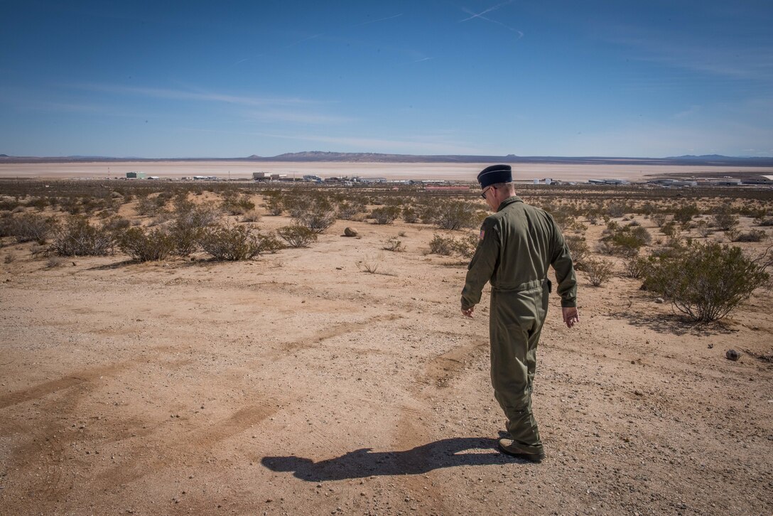 One of the nine flight surgeons who visited Edwards walks to a "lookout spot" to see Rogers Dry Lake and the base. The officers received briefings and tours at the 412th MDG facilities, NASA’s Armstrong Flight Research Center, Joint Strike Fighter units, the Benefield Anechoic Facility, U.S. Air Force Test Pilot School and finally a tour of the Air Force Flight Test Museum. (U.S. Air Force photo by Matt Williams)