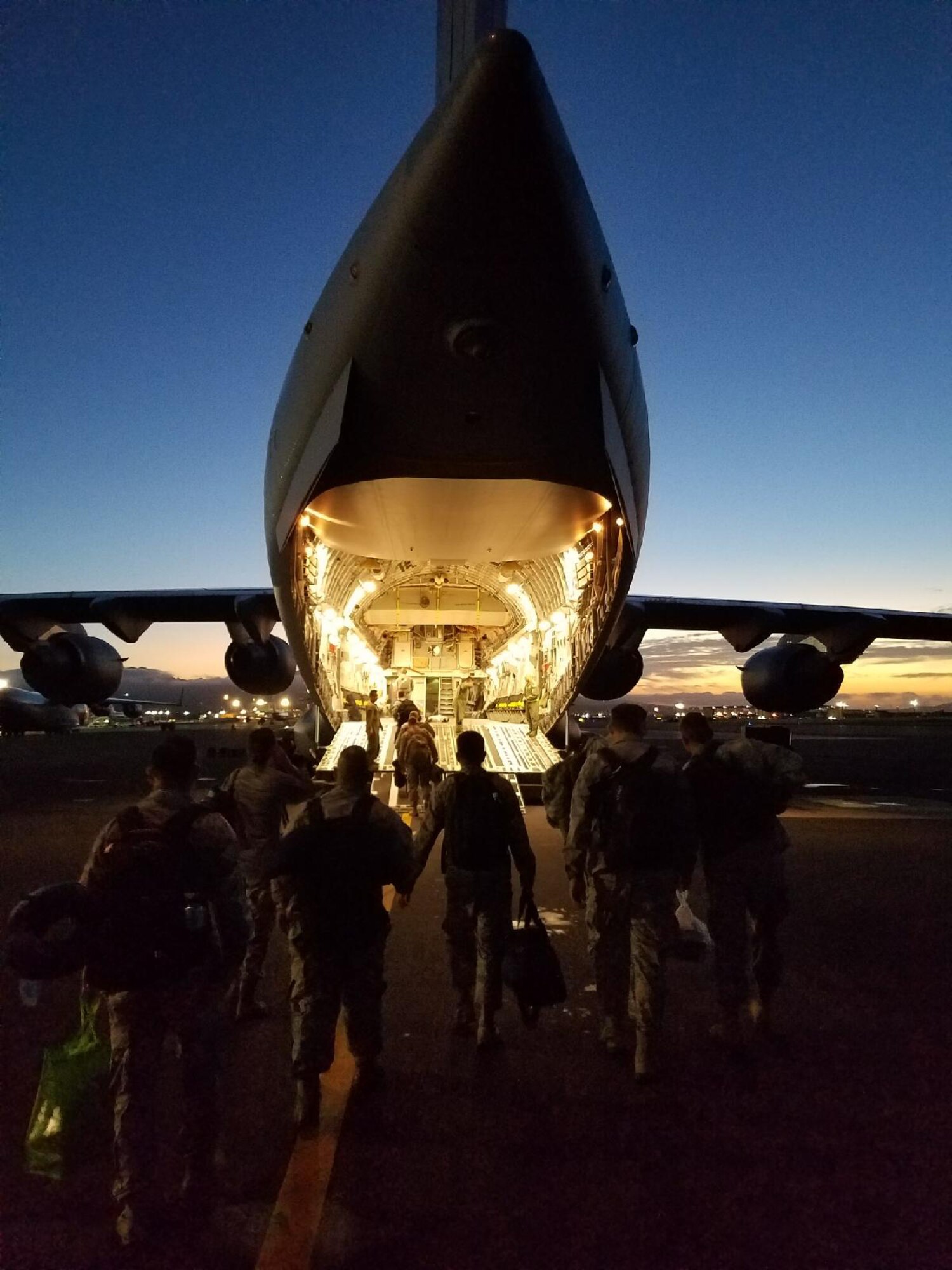Airmen from the 154th Medical Group, Detachment 1, board a C-17 Globemaster III assigned to the 204th Airlift Squadron,  Joint Base Pearl Harbor-Hickam, Jan. 26, 2018.