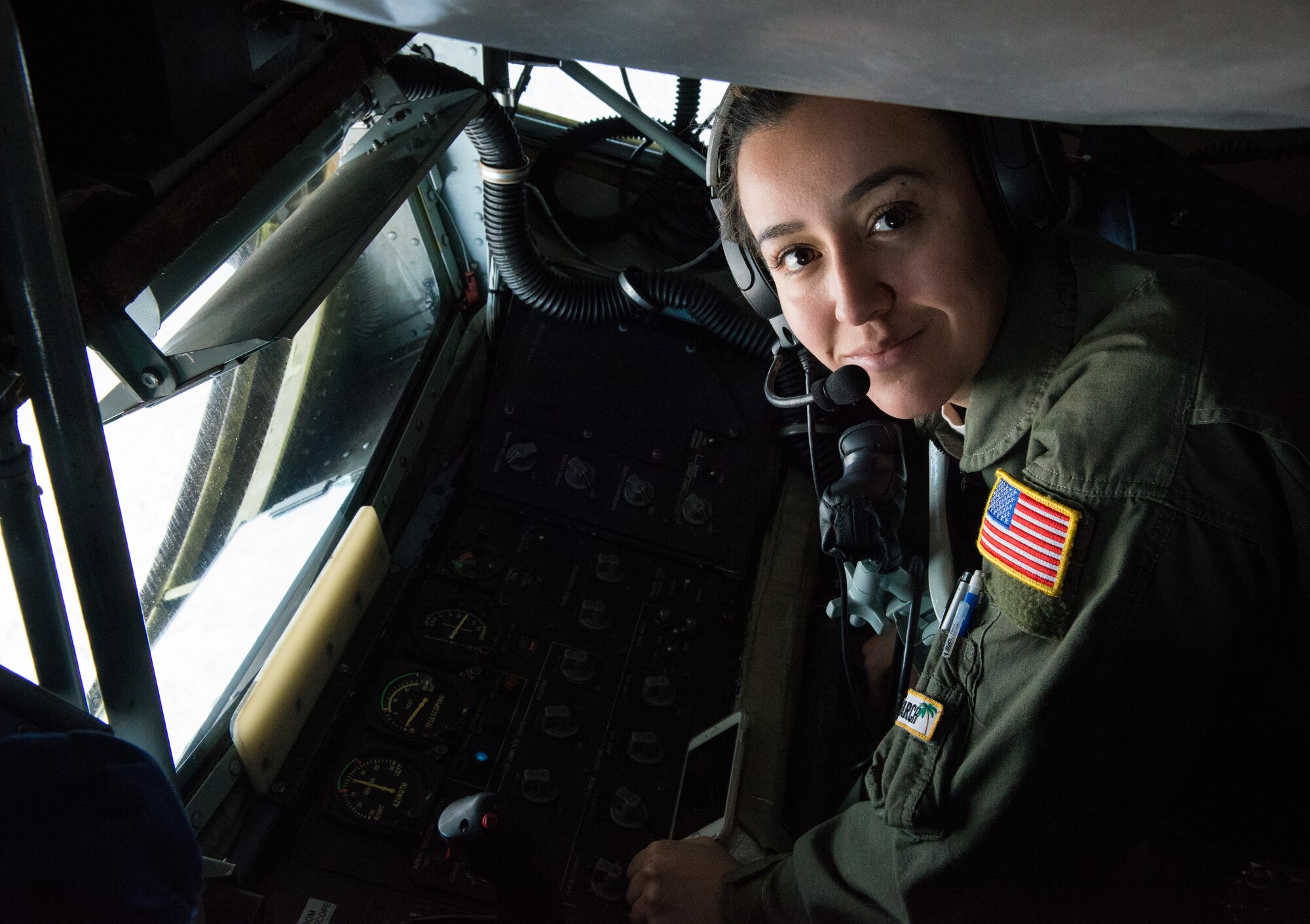 Staff Sgt. Kristi Mendez, 452nd Air Mobility Wing boom operator, poses for a portrait it during an in-flight refueling mission over Arizona, March 12, 2018. Mendez has worked as a boom operator providing precision guidance for aircraft refueling missions for three years. (U.S. Air Force photo/Airman 1st Class Alexander Cook)