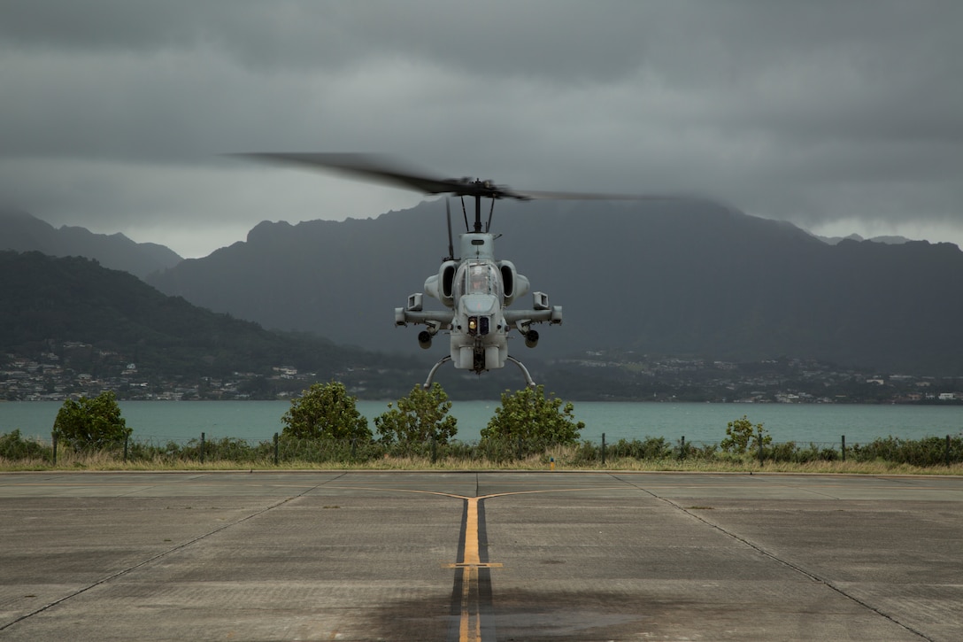An AH-1W Super Cobra completes its final flight on Marine Corps Base Hawaii, March 13, 2018. Marine Light Attack Helicopter squadron is retiring their AH-1Ws, which are being replaced by the AH-1Z Viper helicopters. The first three AH-1Zs arrived to HMLA-367 in December 2017. (U.S. Marine Corps photo by Sgt. Kathy Nunez)