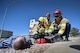 James Kuhn, Jerry Quintana, and Jon Rinesmith, firefighters with the Schriever Air Force Base Fire Department, tend to an exercise victim during Opinicus Vista 18-1 at Schriever Air Force Base, CO, March 6, 2018. The 50th Space Wing Inspector General’s office conducted OV 18-1 to evaluate the wing’s first responders’ ability to respond to an emergency situation. (U.S. Air Force photo by Dennis Rogers)