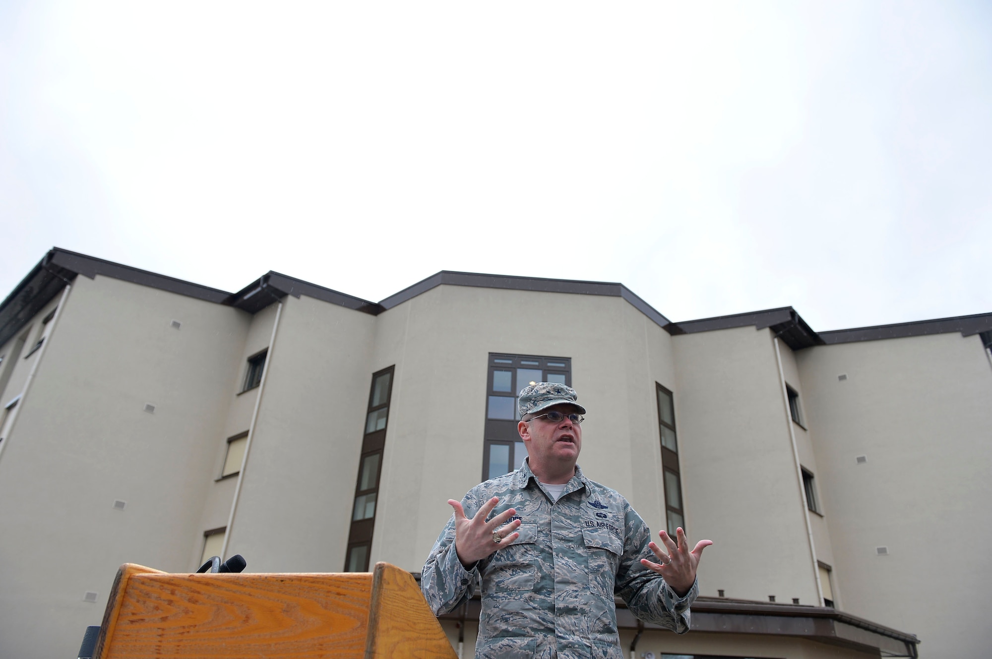 U.S. Air Force, Brig. Gen. Richard G. Moore Jr. gives remarks during a ribbon-cutting ceremony on Ramstein Air Base, Germany, March 7, 2018. The building project for dorm 2411 took more than ten years to complete if counting the planning stage. (U.S. Air Force photo by Senior Airman Joshua Magbanua)
