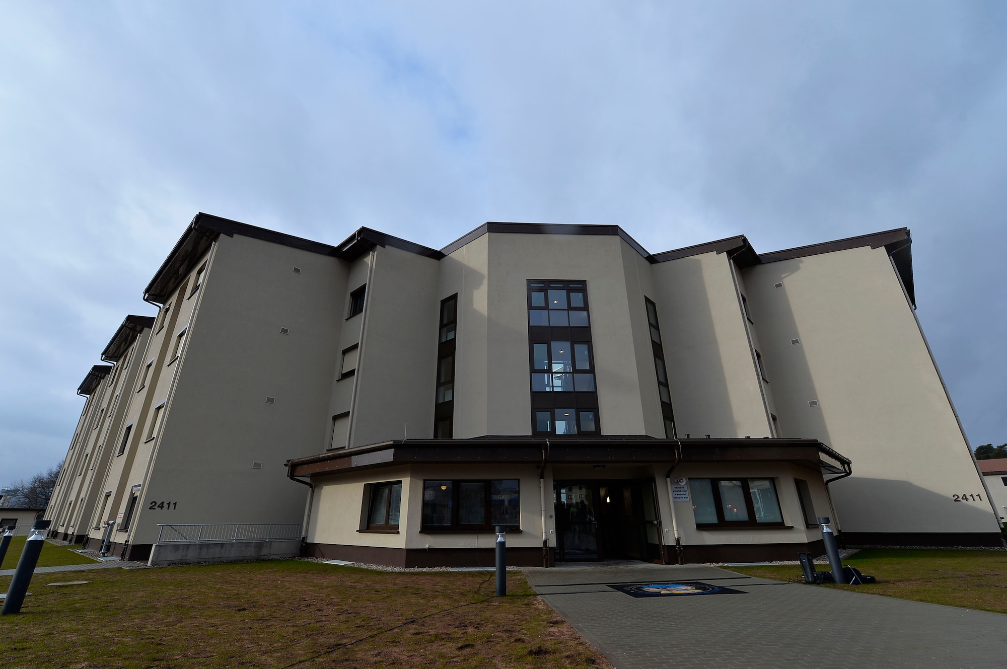 Building 2411, a new dormitory, shines in the sunlight on Ramstein Air Base, Germany, March 7, 2018. The building is expected to replace the older dorm 2413. (U.S. Air Force photo by Senior Airman Joshua Magbanua)