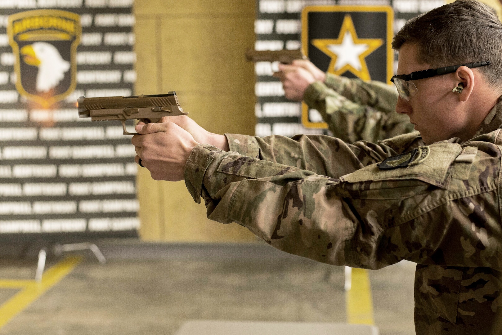 A soldier with 1st Brigade Combat Team, 101st Airborne Division (Air Assault), fires the new M17, or Modular Handgun System, at the 5th Special Forces Group (Airborne) indoor range. The 101st Airborne Division (Air Assault), the world’s only air assault division, is the first unit in the Army to field the service’s new handgun which replaces the M9 pistol, the standard Army sidearm since 1986.