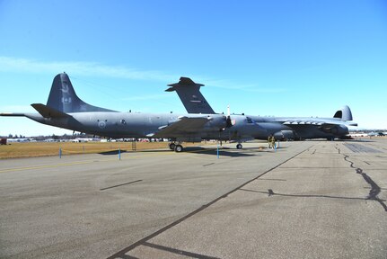 Preparing for the airshow, Canada’s CP-140 Lockheed Aurora in the forefront of the 433rd Airlift Wing’s C-5M Super Galaxy at the Abbotsford International Airport, in Abbotsford British Columbia, Canada to celebrate a week of International Women’s Day, March 10-11, 2018 at the “Sky’s the limit- Girls fly too” airshow.  (U.S. Air Force photo by Ms. Minnie Jones)