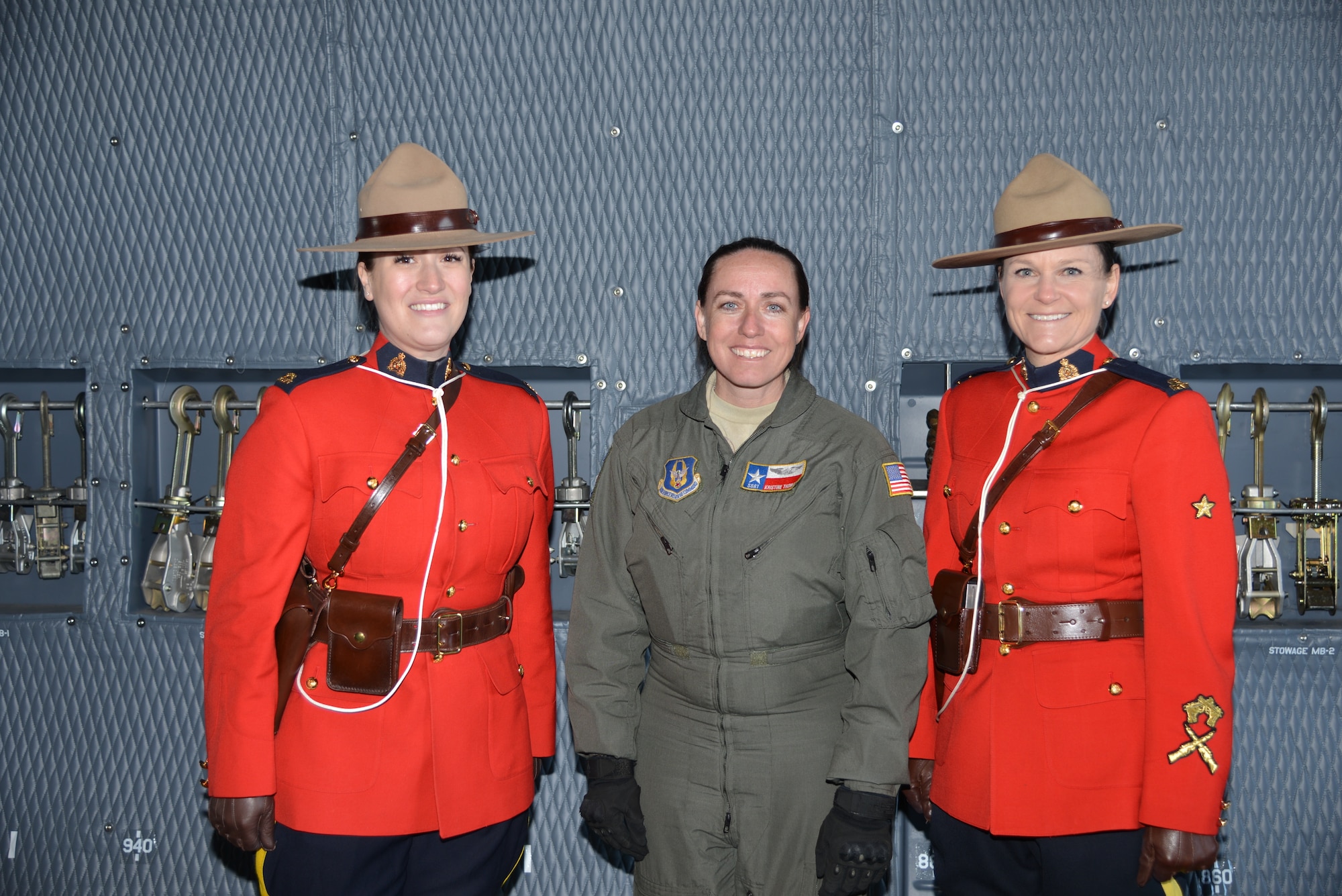 Royal Canadian Mounted Police, Courtney Twolan and Lorelei Jeffrey pose with Staff Sgt. Kristine Thomas, loadmaster and affiliation Instructor, 433rd Contingency Response Flight loadmaster, and affiliation Instructor with the Joint Base San Antonio-Lackland, Texas during a tour of the C-5M Super Galaxy aircraft at the Abbotsford International Airport in Abbotsford British Columbia, Canada. The airport celebrates a week of International Women’s Day, March 10-11, 2018, during the “Sky’s the limit-Girls fly too” Airshow. The RCMP provides law enforcement at the federal level. It also provides policing on a contract basis to the three territories (Northwest Territories, Nunavut, and Yukon), and eight of Canada's provinces. (U.S. Air Force photo by Ms. Minnie Jones)