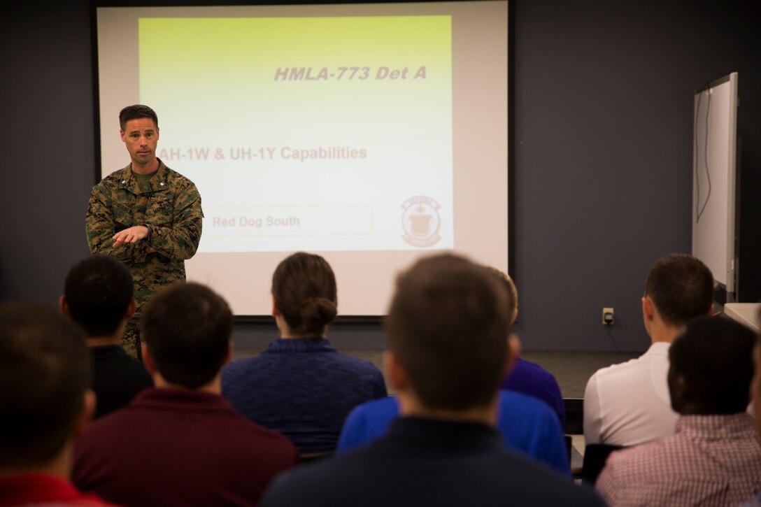 Lt. Col. Andrew M. Turner, commanding officer, Detachment C, Marine Aircraft Group 49, 4th Marine Aircraft Wing, gives opening remarks to Officer Candidate School applicants and candidates from the local Louisiana area before a presentation at Marine Light Attack Helicopter Squadron 773, New Orleans, March 10, 2018. The candidates had the opportunity to view the aircraft at the squadron, talk with the pilots and learn about career opportunities in the Marine Corps. (U.S. Marine Corps photo by Sgt. Melissa Martens)