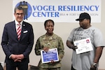 Sgt. 1st Class Iris Autrey (middle), a combat medic specialist with Company A, 187th Medical Battalion, gathers her thoughts before addressing her fellow graduating class members after receiving her certificate March 2 from the Soldier 360 Leadership Resiliency Course at the Vogel Resiliency Center at Joint Base San Antonio-Fort Sam Houston. Her husband, Antonio Autrey (right), also received a certificate as a participant in the course.