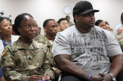 Sitting beside her husband of 17 years, Sgt. 1st Class Iris Autrey (left), a combat medic specialist with Company A, 187th Medical Battalion, listens to a guest speaker during the 360 Leadership Resiliency Course graduation March 2 at Joint Base San Antonio-Fort Sam Houston. Some of the subjects taught to non-commissioned officers included stress management techniques, sleep management, journaling, diet, pain management, nutritional fitness, couples and parent-child communication, leadership, suicide prevention and physical conditioning.