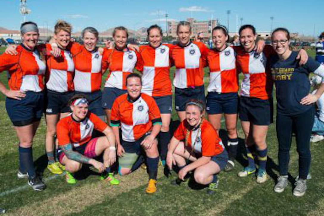 The Coast Guard women’s rugby team poses together.