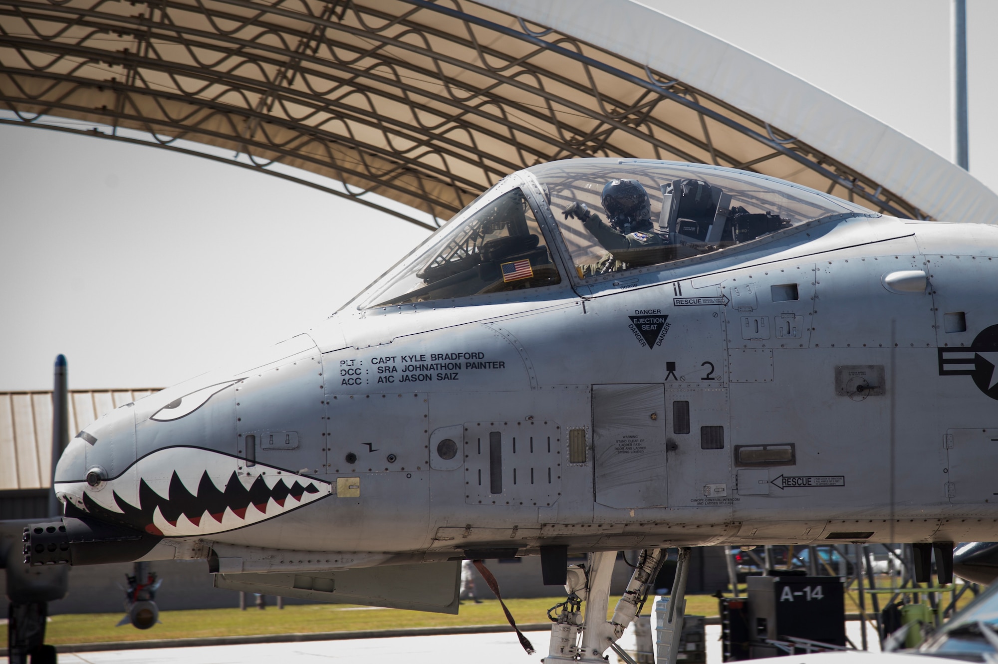 A pilot from the 74th Fighter Squadron A-10C Thunderbolt II pilot, waves to 15-year-old Jarod Story, while taxing on the flightline, March 14, 2018, at Moody Air Force Base, Ga. Pilots from the 23d Fighter Group made Storey, who is terminally ill with Osteosarcoma, a rare form of bone cancer, an honorary A-10 pilot for a day. (U.S. Air Force photo by Andrea Jenkins)